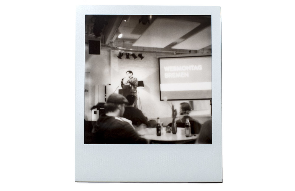 Polaroid of me at the stage of Webmontag Bremen